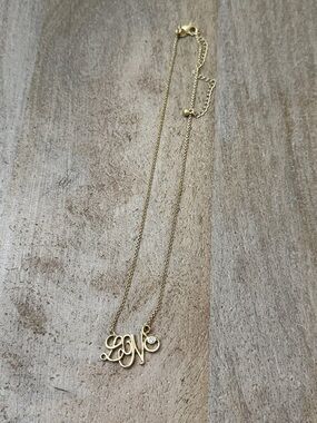 Lia Sophia love necklace. Gold Script Initial Necklace with Cubic Stone Accent